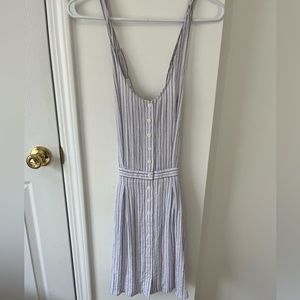 White and black striped dress with pockets, adjustable straps